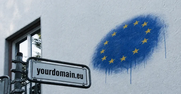 Πινακίδα «yourdomain.eu» δίπλα σε graffiti με τα αστέρια της Ευρωπαϊκής Ένωσης.